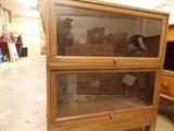 Old bookcase - two that stack on top of each other with retractable glass doors.
