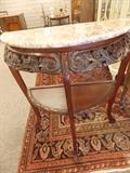 Marble topped entry table. Ornate scrolling in Queen Anne style.