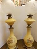 Oil lamps with glass shades.  