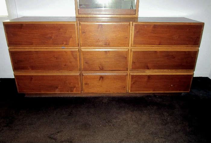 Mid-Century Modern triple dresser of light and dark Oak with 9 drawers and matching, attached, mirror by Lane.