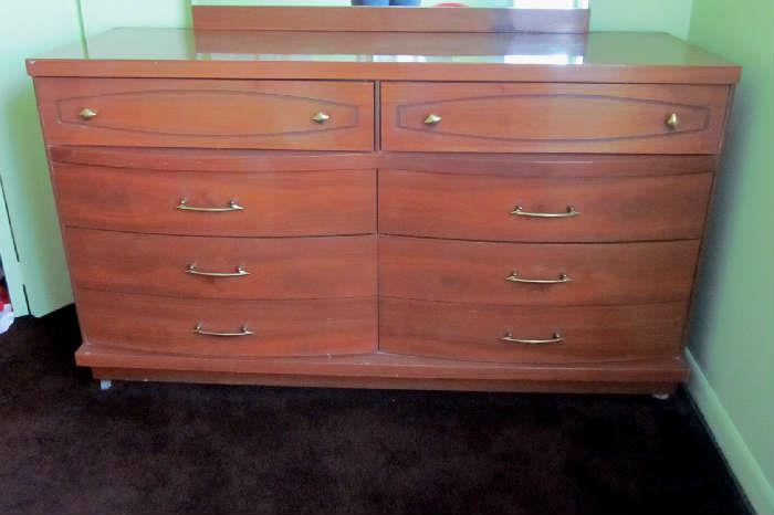 Mid Century double dresser with 8 drawers and attached mirror by Bassett.