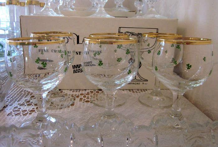 Shamrock wine glasses with gold rims.