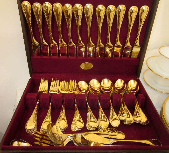 Gold electroplated stainless flatware by Stanley Roberts.  Service for 12 plus serving pieces and storage chest.
