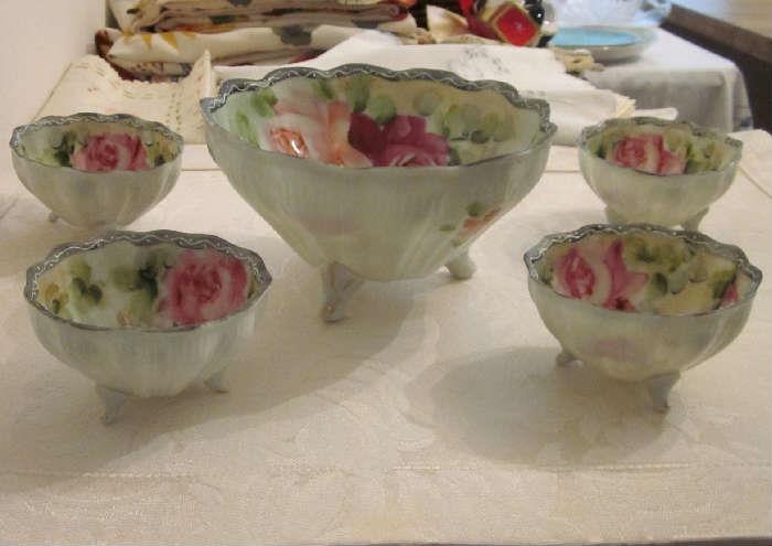 Vintage scalloped 3-footed bowl with four matching individual bowls, made in France.