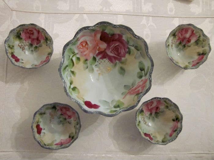 Vintage scalloped 3-footed bowl with four matching individual bowls, made in France.