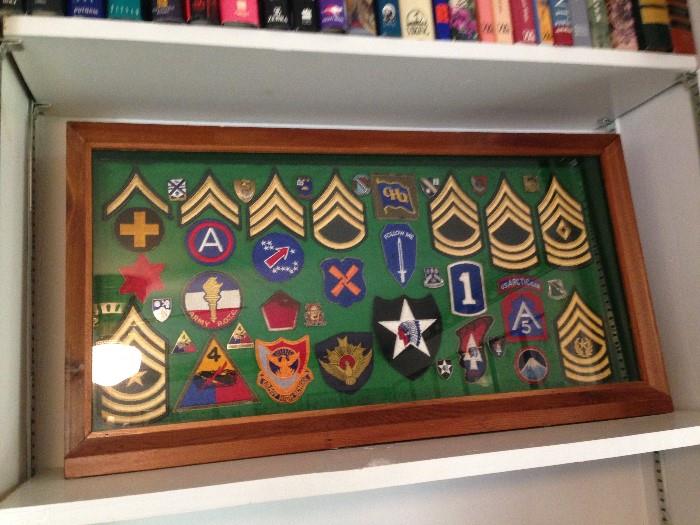 Shadow box of military patches. This gentleman was enlisted in 1939 and retired a Command Sgt. Major