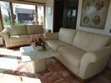 Leather Sofa and Love Seat and Marble Tables in the back Sun Room.  Antique Framed Tapestry 