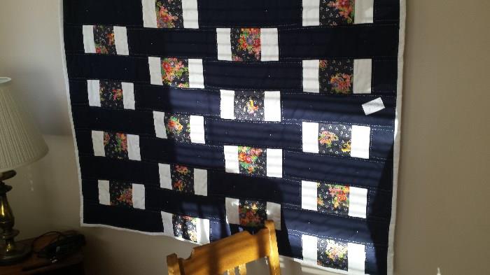 Quilt, navy, white and floral print.  New.  Machine pieced and hand quilted.