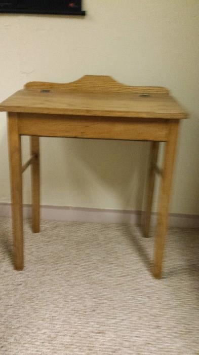 Antique oak children's flip top desk.  Refinished in the past three years.  Original hardware.  Excellent shape.