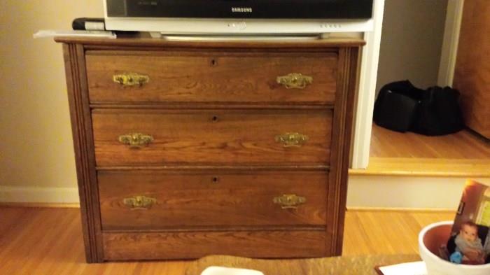 Antique dresser in excellent condition. Not the original hardware. refinished about 20 years ago.  51 X 18, oak.