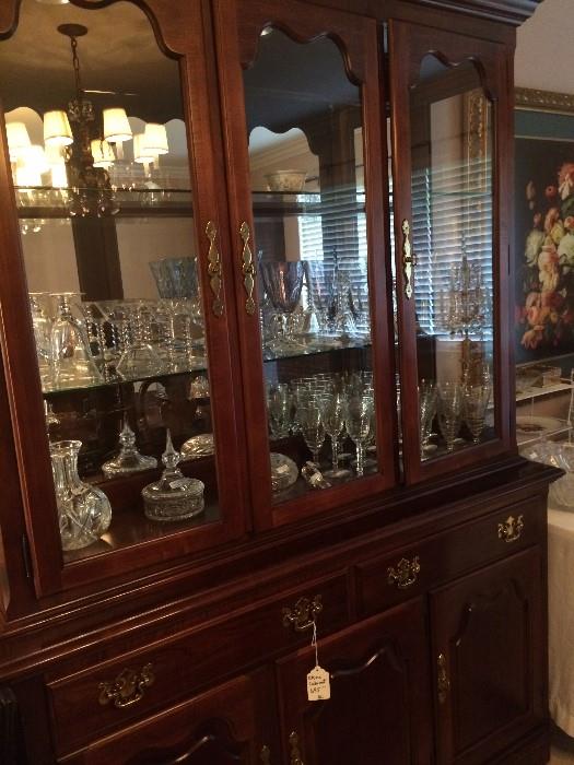 Dining room china cabinet; numerous pieces of crystal