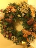 Custom wreath has matching over-the-door decorations.