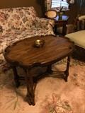 One of two love seats; coffee table; side/armed chair