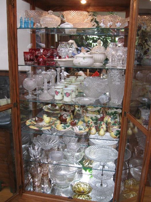 GLASSWARE FROM WATERFORD, FENTON AND OTHERS. CERAMICS BY FITZ AND FLOYD. 