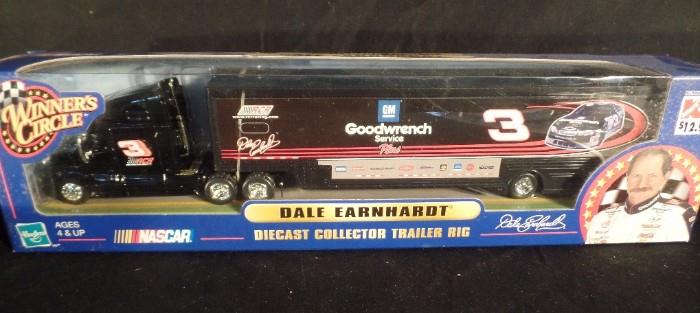 www.CTOnlineAuctions.com/SandhillsNC             Dale Earnhardt Sr, Posters, Cards and Cars - II
Several Dale Earnhardt Sr. memorabilia items including:
     - (1) laminated poster
     - (1) unopened 1:64 scale collector car
     - (2) trading cards
     - (1) unopened poster, 'Intimidator'
     - (1) die-cast collector trailer and rig, in original box, Hasbro