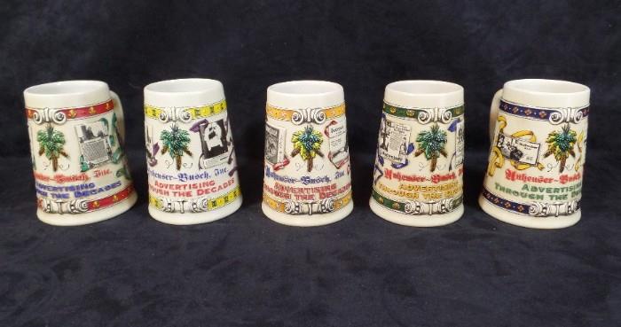 www.CTOnlineAuctions.com/SandhillsNC             Five Advertising Through the Decades Steins
(5) Anheuser-Busch Steins, 'Advertising Through the Decades' Series, including:
     - 1911-1915
     - 1933-1937
     - 1879-1912
     - 1905-1914
     - 1918-1932