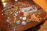 Costume jewelry, stick pins, Bakelite dice, and more!