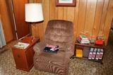 La-Z-boy recliner, books, lamp table, etc.