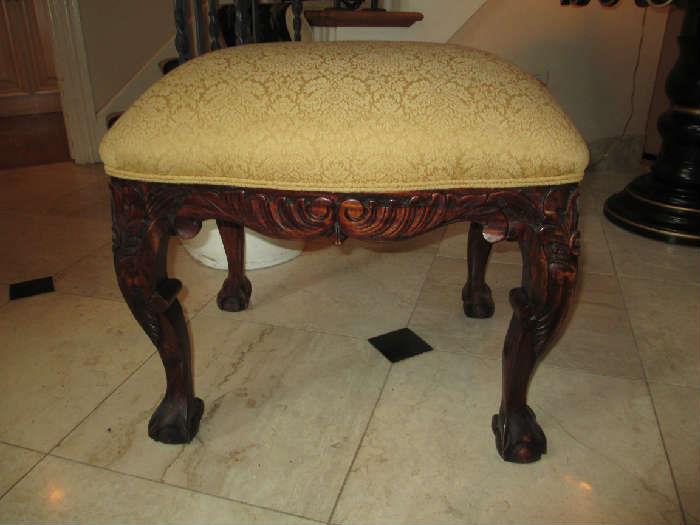 FOOT BENCH WITH CARVED LEGS ON BALL AND CLAW FOOTING
GOLD CUSHIONED FABRIC COVER
