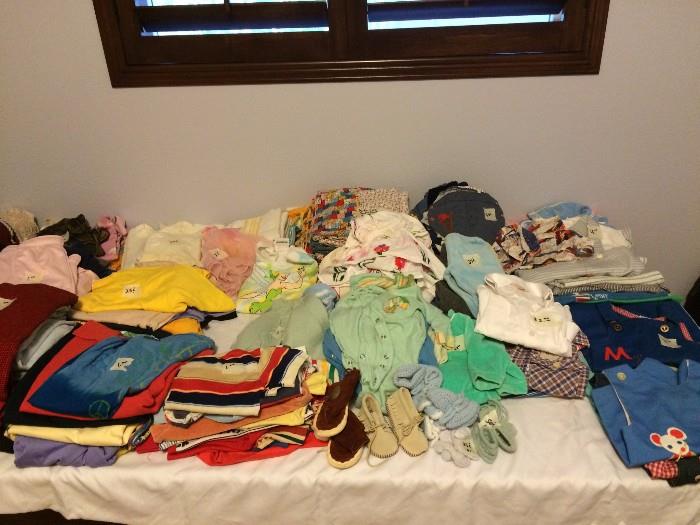Lots of baby clothes, some designer labels such as Christian Dior. 