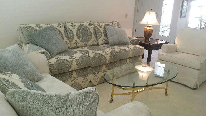 Best Chairs Love seat, Drexel Heritage sofa, glass coffee table, wood end table, enamel lamp and Best Chairs armchair (matching ottoman is not shown).