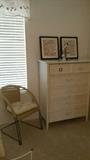 Rattan chair and Dixie white wicker and wood highboy dresser