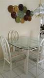 Dinette for 4. Metal art featured above table.