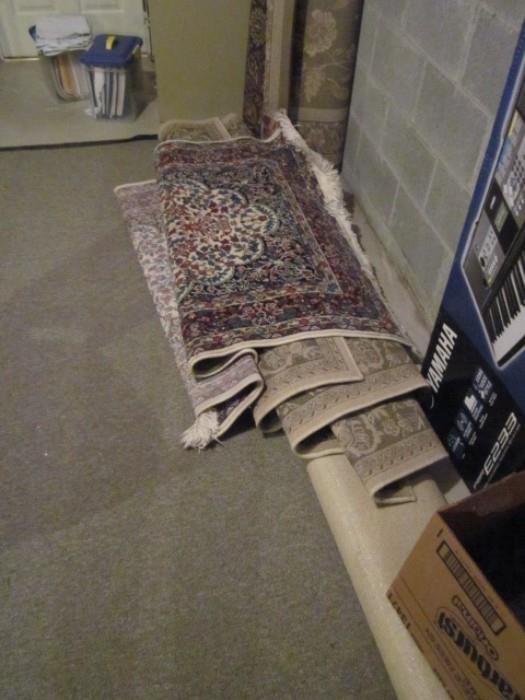 Various oriental design rugs.