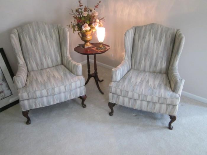 Pair wing back chairs and table.