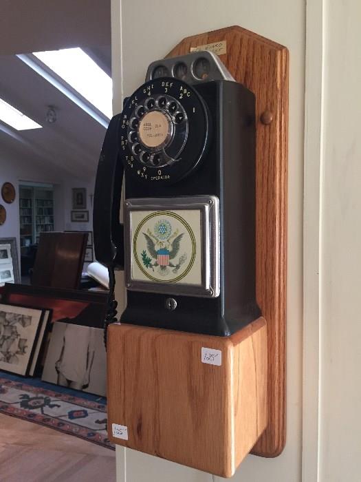 Wall-mounted pay phone