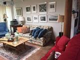 Floral sofa, red sofa, coffee table, Bang & Olufsen 5500 stereo components