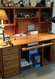 Oak desk, office supplies, clocks