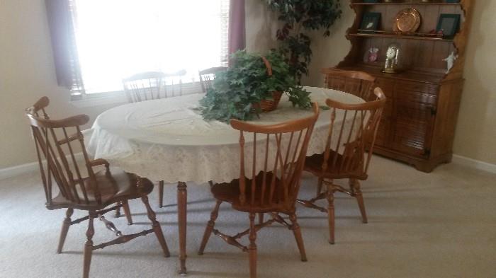 Ethan Allen dining table with 2 leaves, table pad, six chairs and matching hutch (in background)