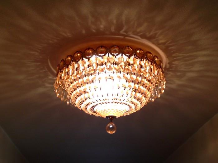 Swartkowski crystal ceiling light that matches the larger dining room light...