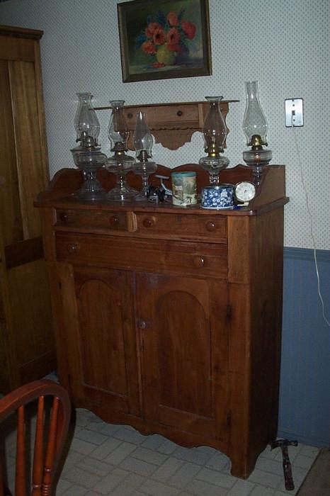 Oil lamps everywhere--and a great walnut jelly cabinet.