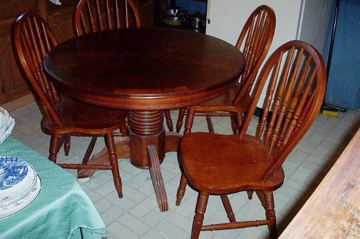 Small newer pedestal table--with 4 chairs--in great shape.