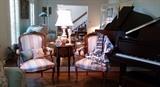 Formal mirrored LR showing baby grand piano and 2 of several occasional chairs