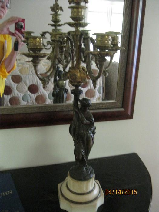 One of pair bronze candleholders