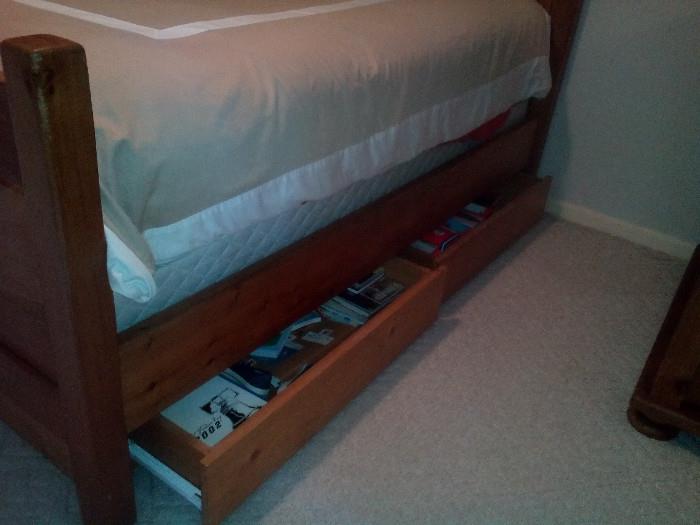Storage drawers beneath bed