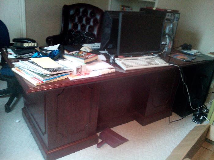 modern desk,    and large executive  black desk chair