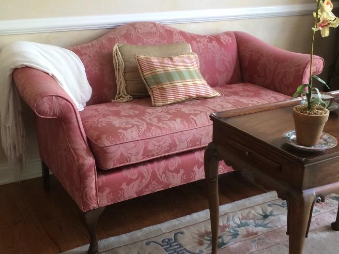 Matching pair of lovely settees, rose color damask upholstery.