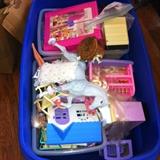 Big tub of Barbie furniture and accessories.