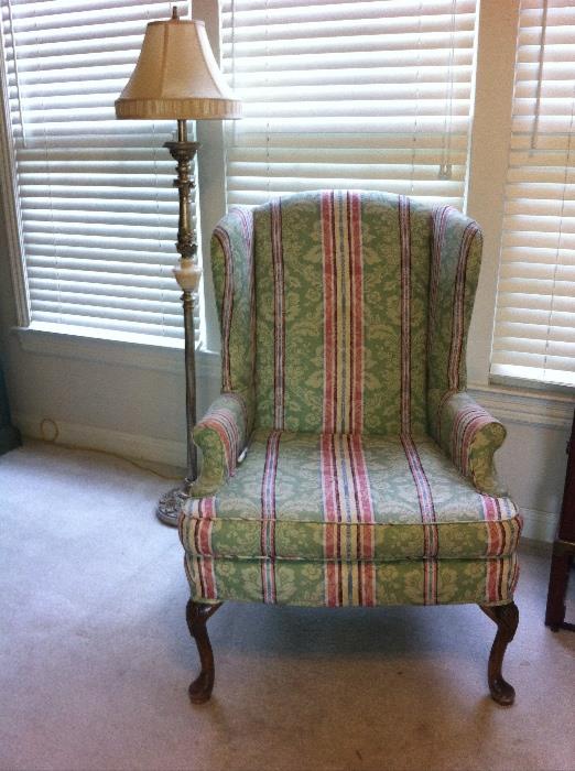 Traditional wing back chair and floor lamp.