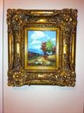 Several original paintings in ornate frames.