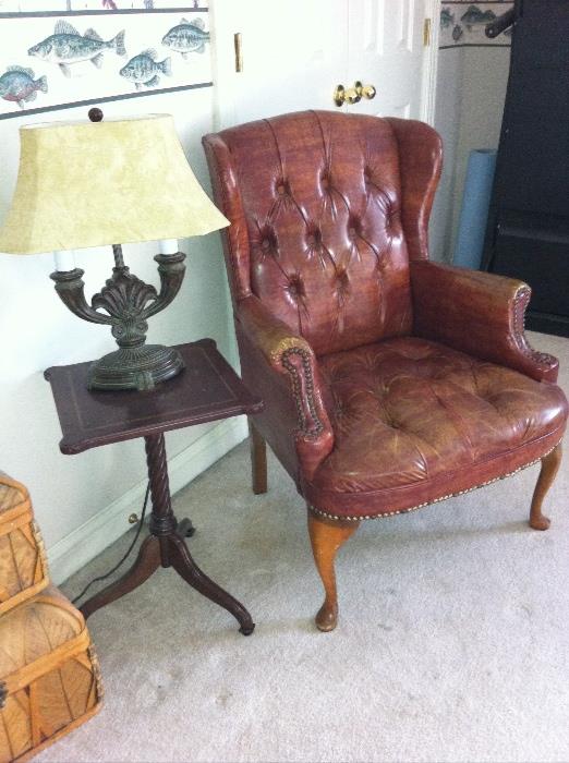 Vintage wingback chair, small table and lamp.
