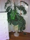 Decorative urn with faux plant.