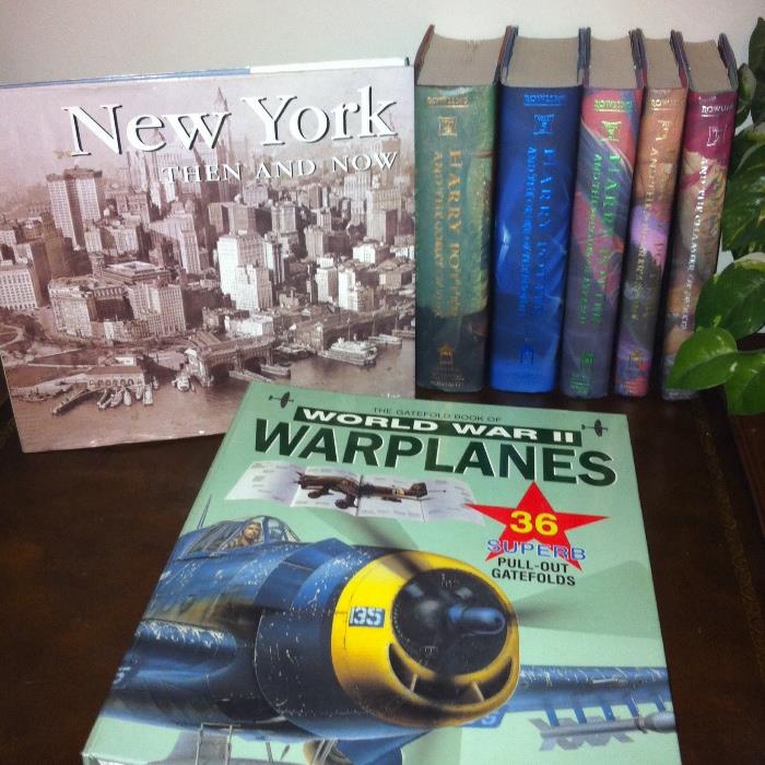 100s of books--cookbooks, novels, history and more. Shown here, Harry Potter, New York coffee table book and World War II Warplanes.