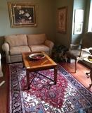 Home taupe loveseat, Oriental rug, inlaid wood coffee table, art, pair of ultra suede side chairs