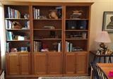 Set of 3 oak bookcases with adjustable shelves. Can also be used as a media center.