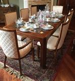 Beautiful dining table atop a Karastan rug